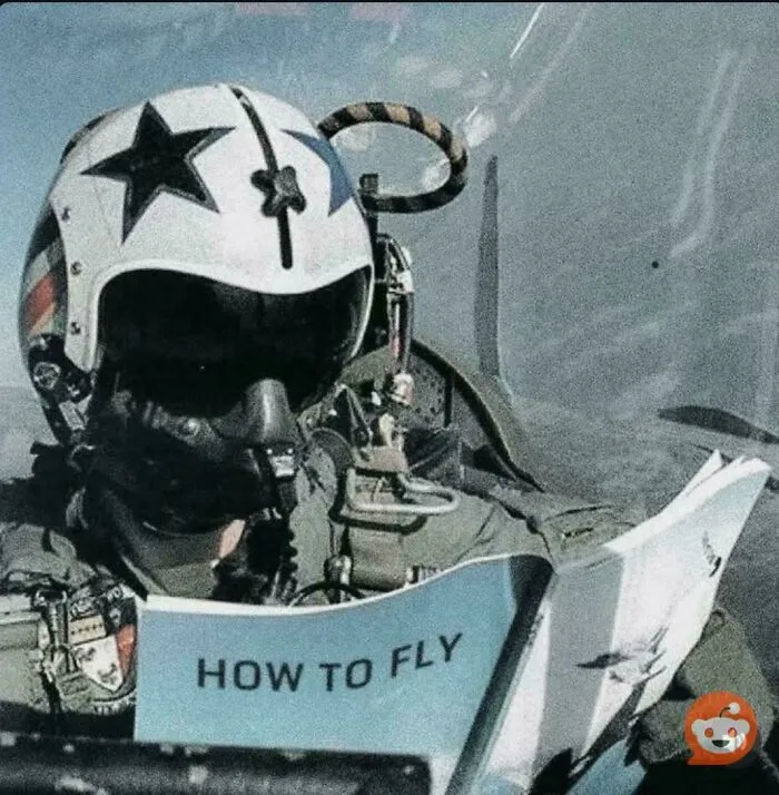 Pilot in cockpit wearing helmet with star logo reading a humorous how to fly manual, a funny picture that goes hard.