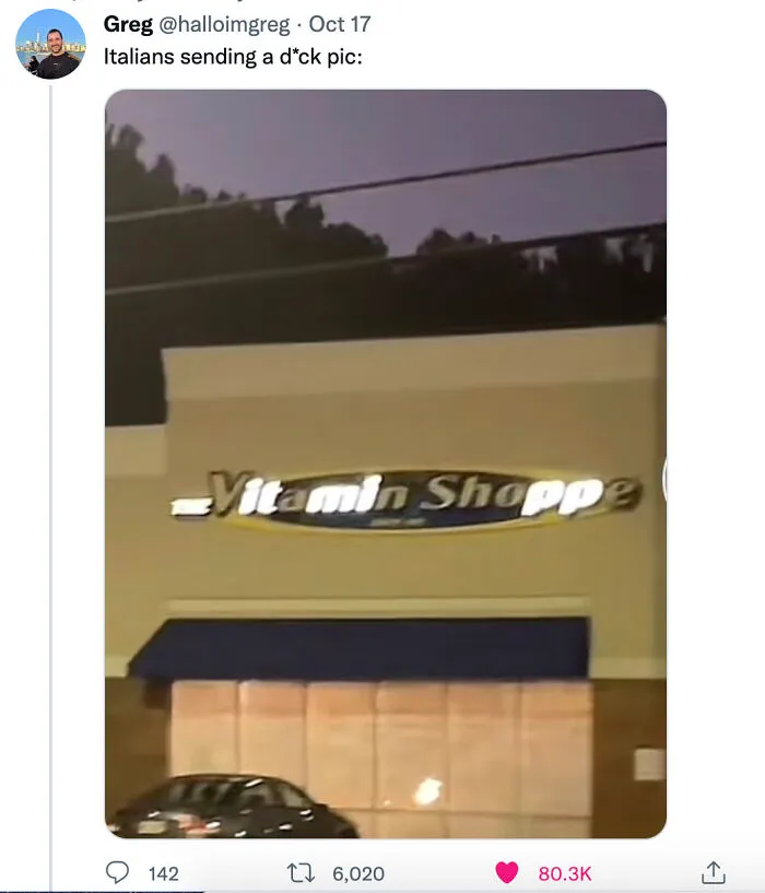 LED sign of a vitamin shop with some letters not fully lit causing an unintended message at night.