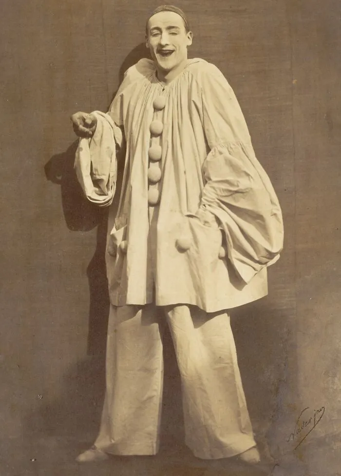 Vintage photo of a man dressed as a clown, showcasing early photography capturing unique costumes and expressions.