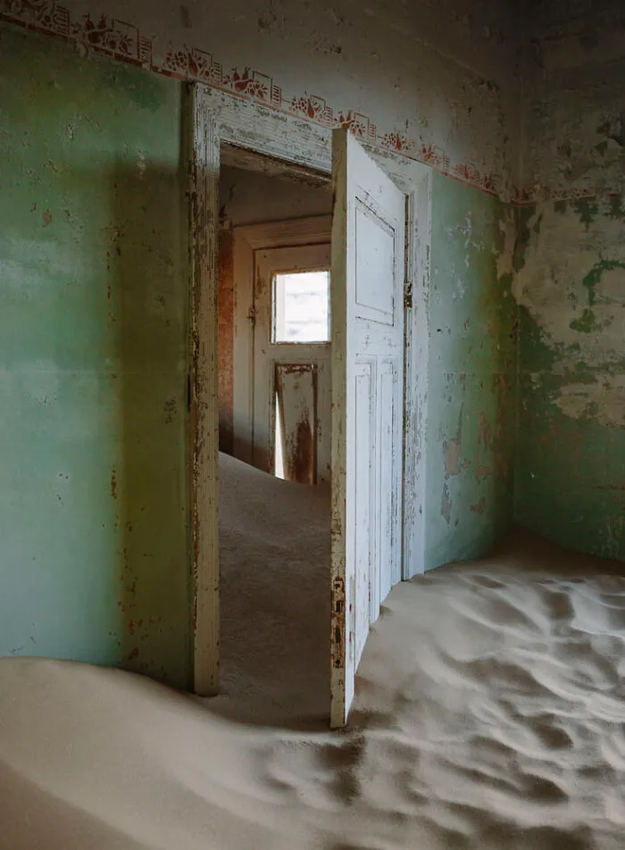 ‘Sand Castles’: 21 Surreal Photos Of Desert Sand Swallowing Abandoned Homes By Emma McEvoy