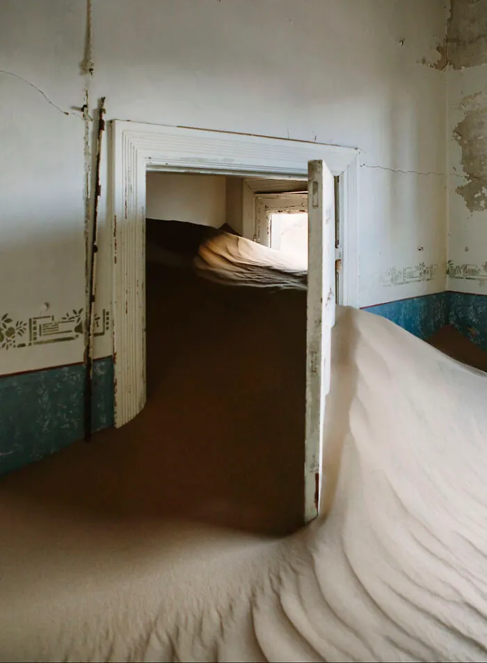 ‘Sand Castles’: 21 Surreal Photos Of Desert Sand Swallowing Abandoned Homes By Emma McEvoy