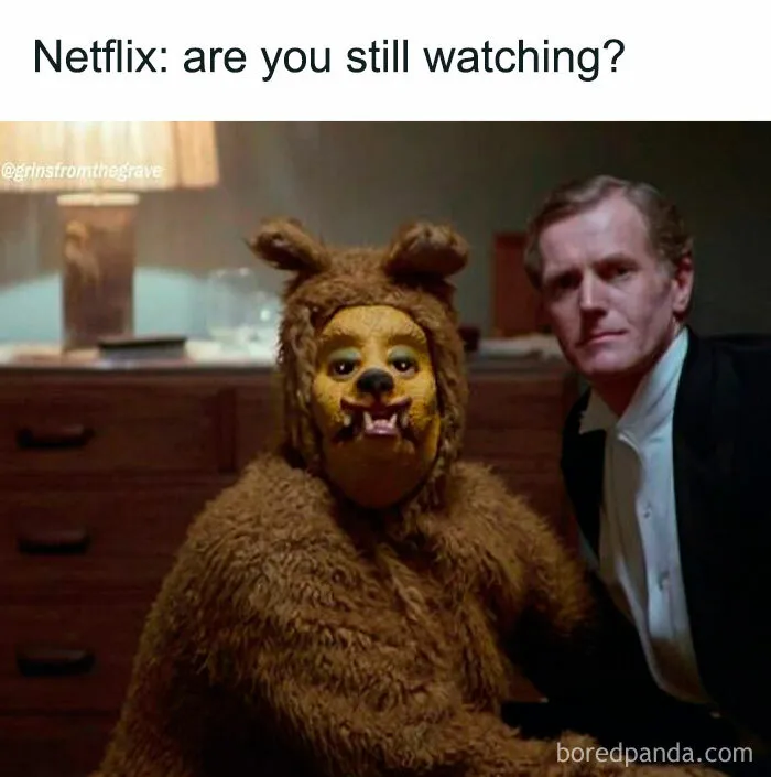 Person in a scary bear costume and another man sitting in a dimly lit room, a horror movie meme with Netflix text.