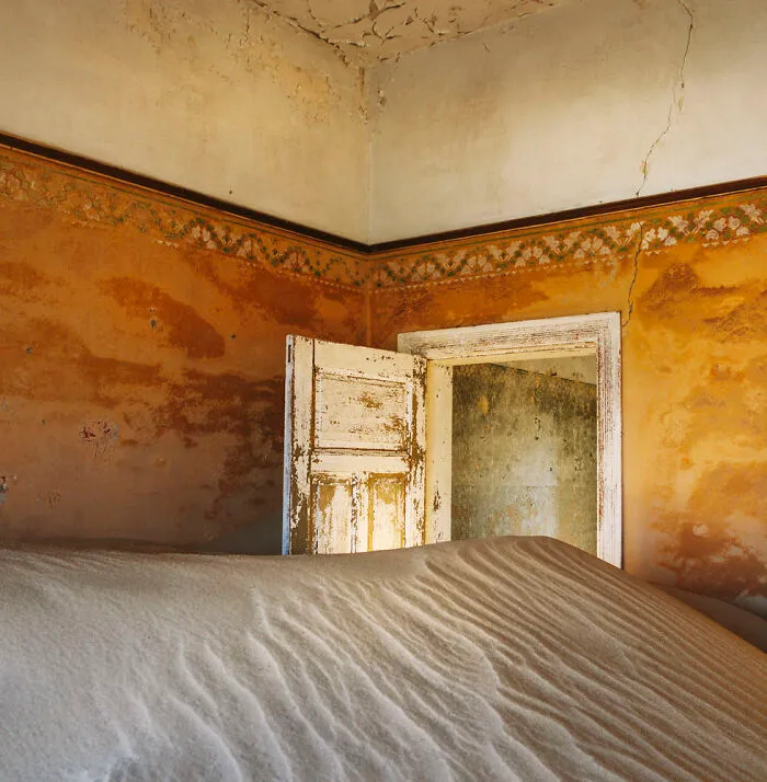 ‘Sand Castles’: 21 Surreal Photos Of Desert Sand Swallowing Abandoned Homes By Emma McEvoy