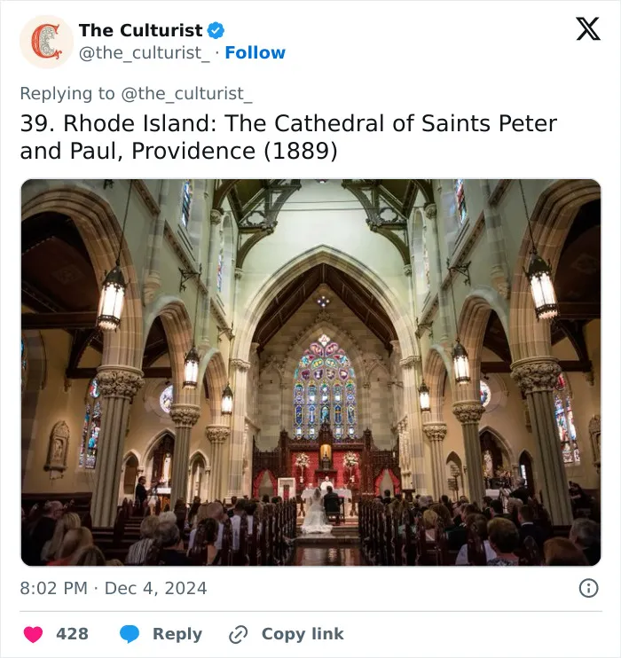 Interior view of a spectacular historic church with stained glass windows and high vaulted ceilings in Rhode Island.