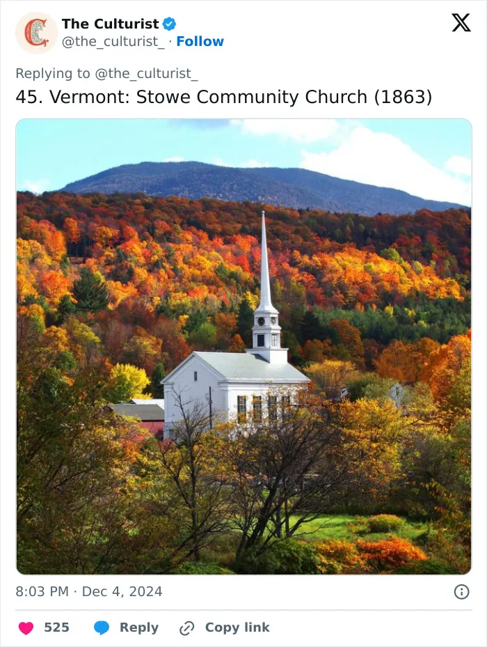 White church with tall steeple surrounded by colorful autumn trees and mountains, a striking church in the US landscape.