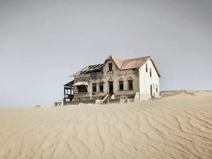 ‘Sand Castles’: 21 Surreal Photos Of Desert Sand Swallowing Abandoned Homes By Emma McEvoy