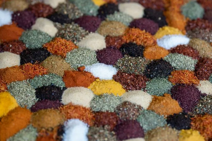 Various colorful spices arranged in a pattern, illustrating mind-bending scenarios that challenge your morals visually.