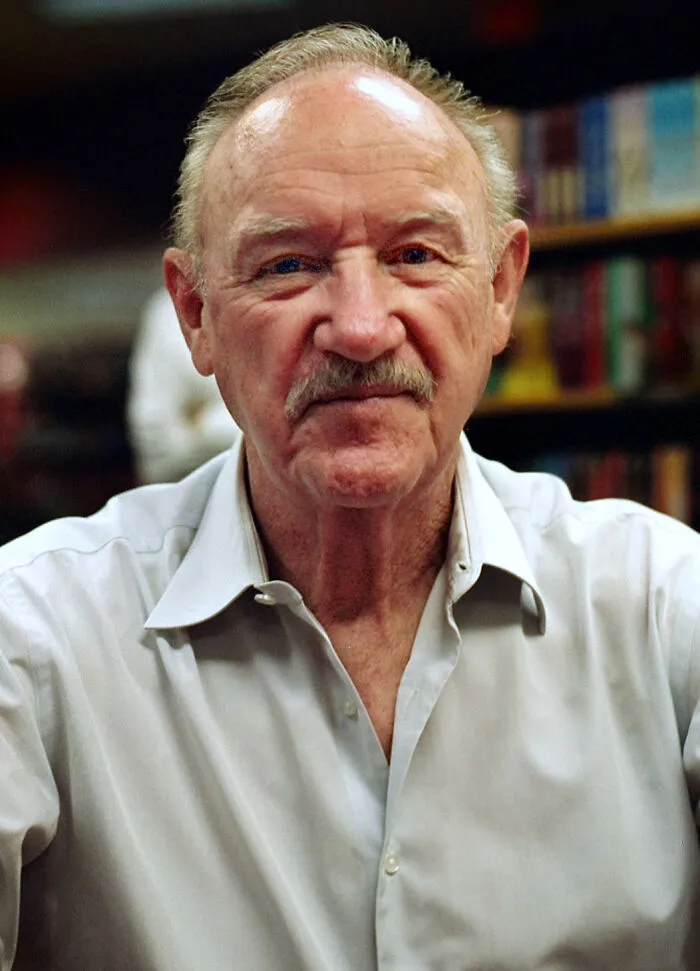Older man with mustache wearing a white shirt, representing Hollywood stars who found fame after 30 years old.
