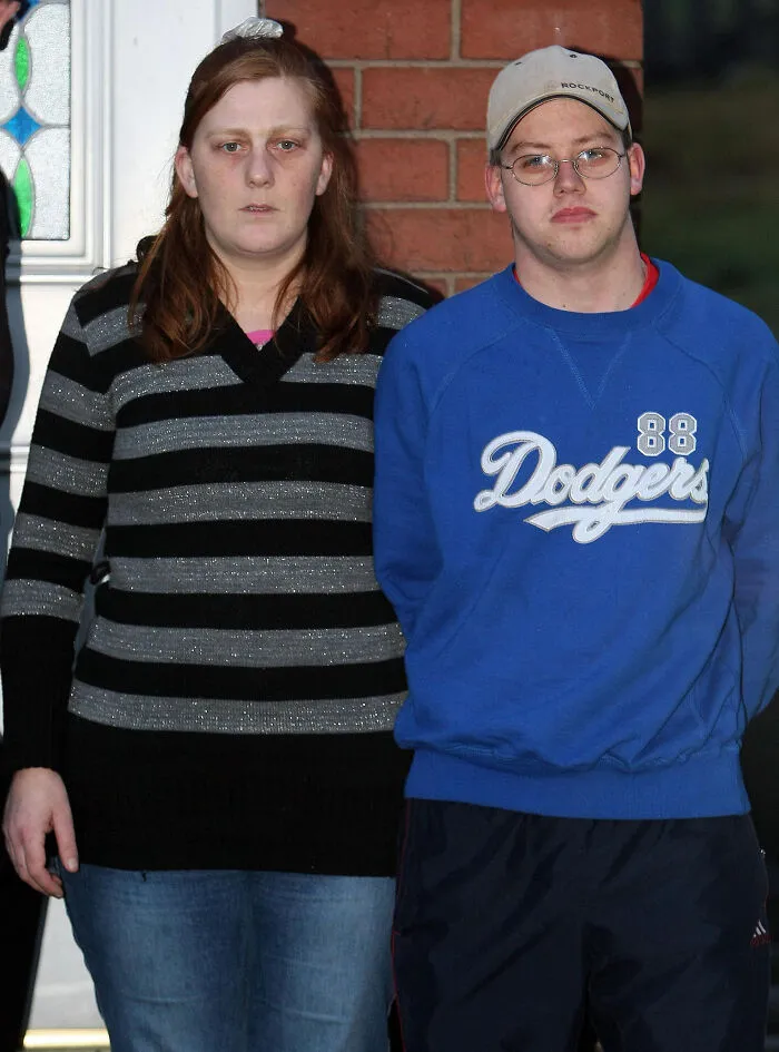 Two people standing outside a home, illustrating experiences of people who had terrible neighbors next door.