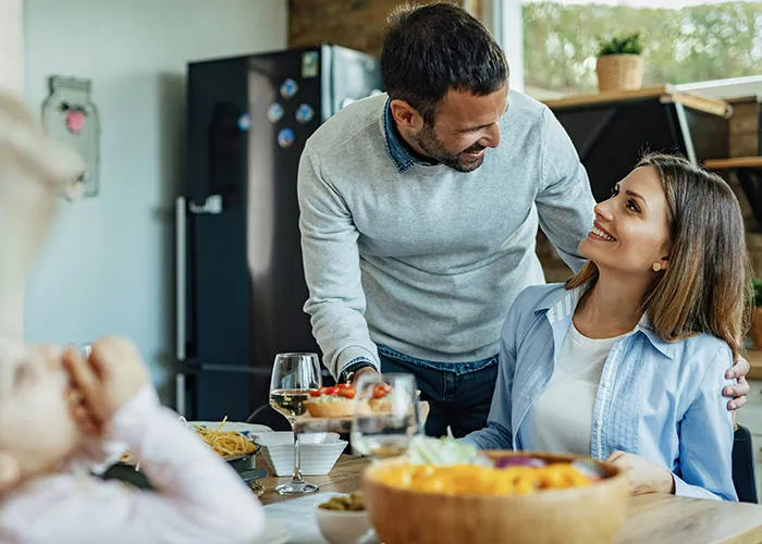 Couple sharing a warm moment at home, highlighting the topic of real benefits of marriage for women.