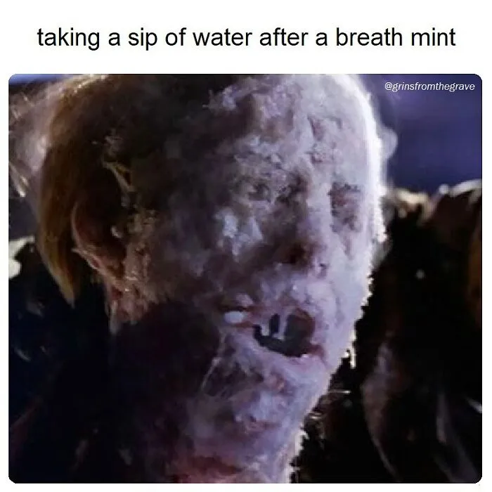 Close-up of a grotesque horror movie character with a caption about taking a sip of water after a breath mint, horror movie memes theme.