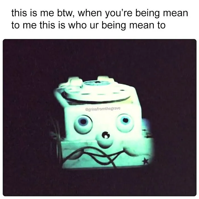 Vintage rotary phone with a spooky face in dim light, a hilarious horror movie meme about being mean to someone.