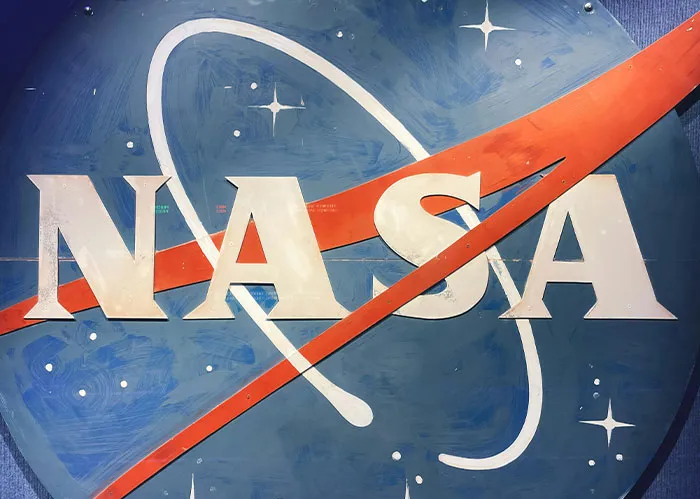 NASA logo painted on a blue background with stars, emphasizing Rihanna slapped him fascinating facts theme.