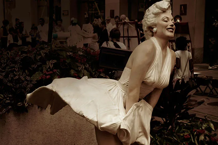 Statue of a woman in a flowing white dress outdoors, illustrating red flags women didn't realize in relationships.