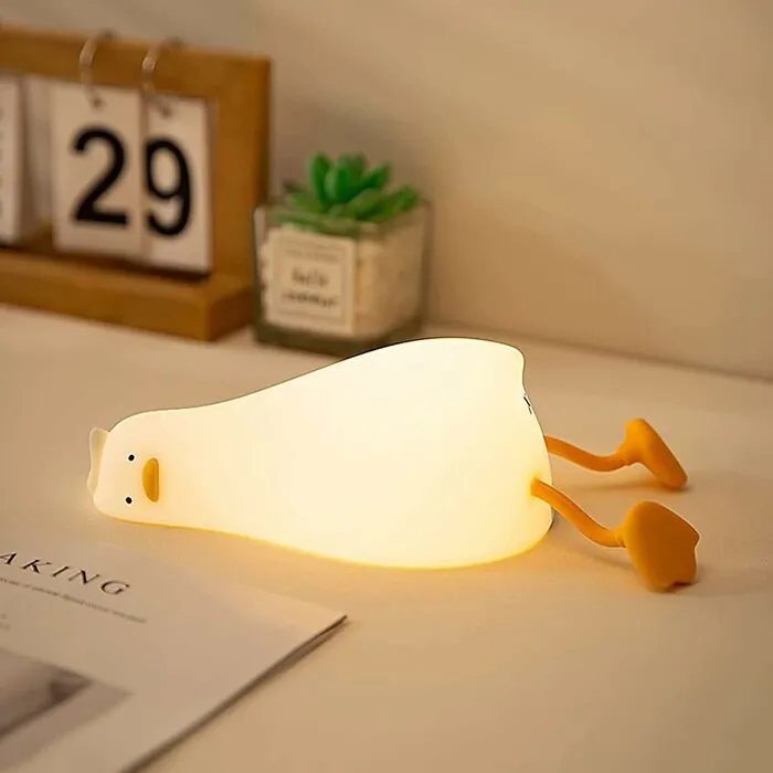Your Desk Is About To Get A New Coworker Who Is An Expert In Emotional Support And Ambient Lighting, And It's A <a Style="Display:inline;" Href="Https://Www.amazon.com/Dp/B0bgbmzmmq?ascsubtag=7953662%2c20%2c35%2cd%2c0%2c0%2c0%2c1396%3a1%3b1338%3a1%3b1515%3a1%2c70812146%2c0%2c0&_encoding=utf8&btn_ref=srctok-A7a016feab94eb22&th=1&linkcode=ll1&tag=bpeagle-20&linkid=8694f1f930b08a914ef348d5fbcf98a4&language=en_us&ref_=as_li_ss_tl" Target="_blank">  <span Style="Font: Inherit; Color: #d74b1f;"> LED Lying Flat Duck Light </Span>