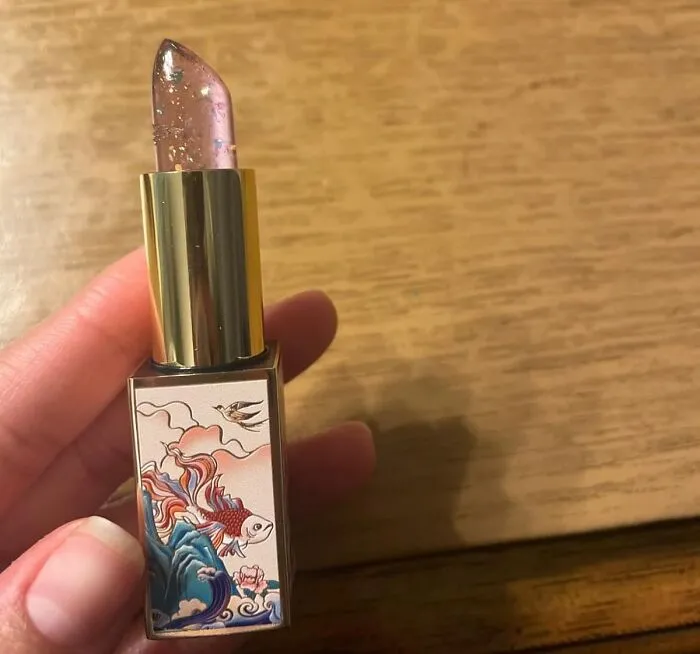 Your Lips Will Get A Subtle Hint Of Color From A Tube So Beautiful You'll Almost Feel Bad Using It With This <a Style="Display:inline;" Href="Https://Www.amazon.com/Glitter-Hydrating-Moistrurizer-Chapstick-Nourishing/Dp/B0d93qb2hq?ie=utf8&th=1&linkcode=ll1&tag=bpbobcat-20&linkid=27a9761ba6caaae03928466cfbc05642&language=en_us&ref_=as_li_ss_tl" Target="_blank">  <span Style="Font: Inherit; Color: #d74b1f;"> Catkin Tinted Lip Balm </Span>