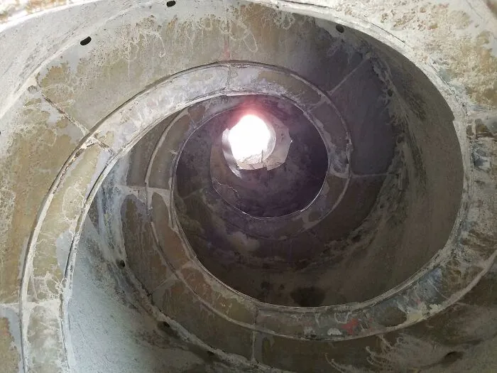 Spiral staircase interior showing rare architectural details in an interesting picture revealing the insides of structures.