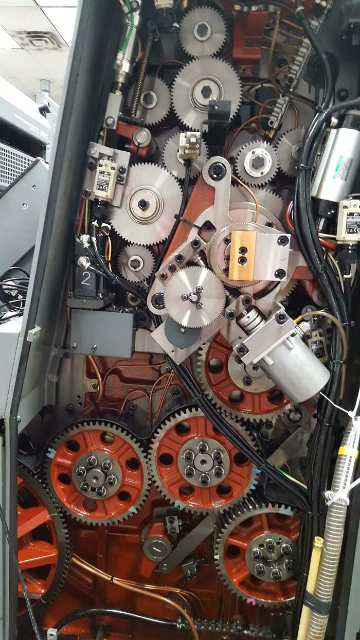 Intricate inside view of mechanical gears and components showing the insides of things we rarely see.