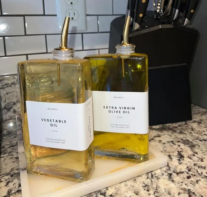 That Sad, Greasy Bottle You've Been Hiding In The Cabinet Can Finally Be Upgraded To Something That Looks Like It Belongs In A Fancy Italian Restaurant, A <a Style="Display:inline;" Href="Https://Www.amazon.com/Molimoli-Oil-Dispenser-Bottle-Automatic/Dp/B0bcnx6wsm?ie=utf8&th=1&linkcode=ll1&tag=bptoucan-20&linkid=5bf7967fcec222956bec99b299d679e5&language=en_us&ref_=as_li_ss_tl" Target="_blank">  <span Style="Font: Inherit; Color: #d74b1f;"> Sleek  Oil Dispenser </Span>