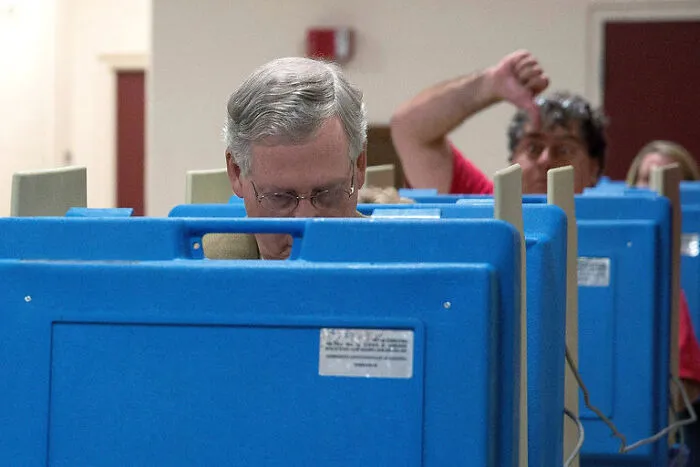 Mitch McConnell’s Vote Photobombed By Unhappy Constituent