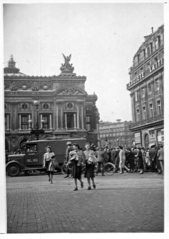 Vintage city street scene with people and historic buildings, illustrating where was this taken internet posts.