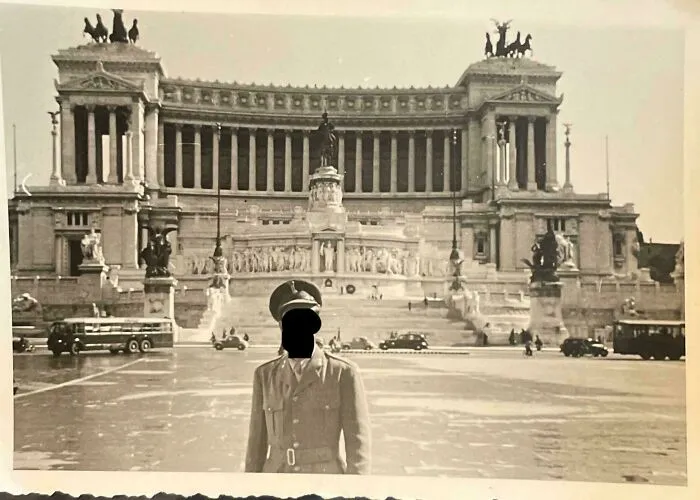 Vintage photo of a man in uniform in front of an ornate historic building from where was this taken posts online.