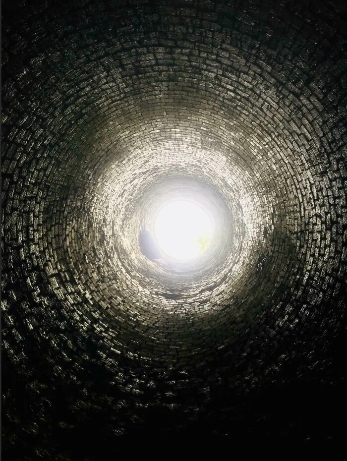 View looking up inside a circular brick structure showing the insides of things we rarely see.