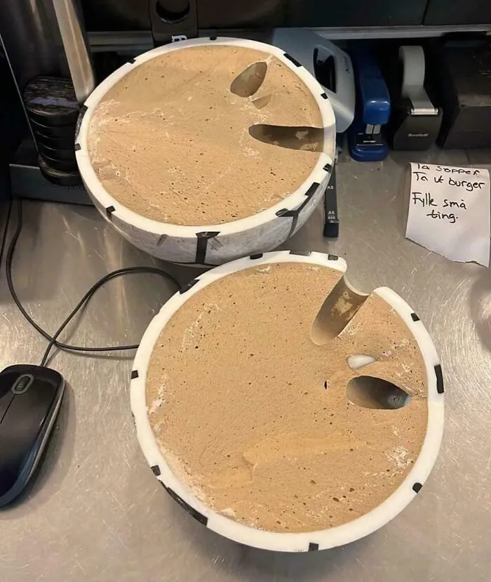 Close-up of two round molds filled with a porous material showing the insides of things we rarely see in a workspace.