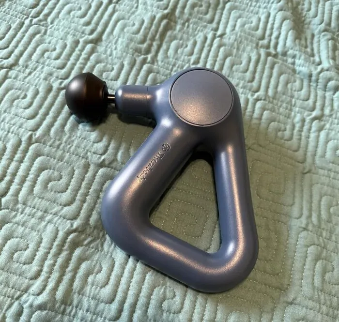 Your Muscles' Favorite New Coworker Is About To Be A <a Style="Display:inline;" Href="Https://Www.amazon.com/Theragun-Relief-Handheld-Percussion-Massage/Dp/B0cns894rh?ie=utf8&th=1&linkcode=ll1&tag=bpgecko-20&linkid=d0238cea25ca9faca9cea7a4ed72e242&language=en_us&ref_=as_li_ss_tl" Target="_blank">  <span Style="Font: Inherit; Color: #d74b1f;"> Handheld Percussion Massage Gun </Span>, And Its Specialty Is Aggressively Convincing Knots To Take A Permanent Vacation