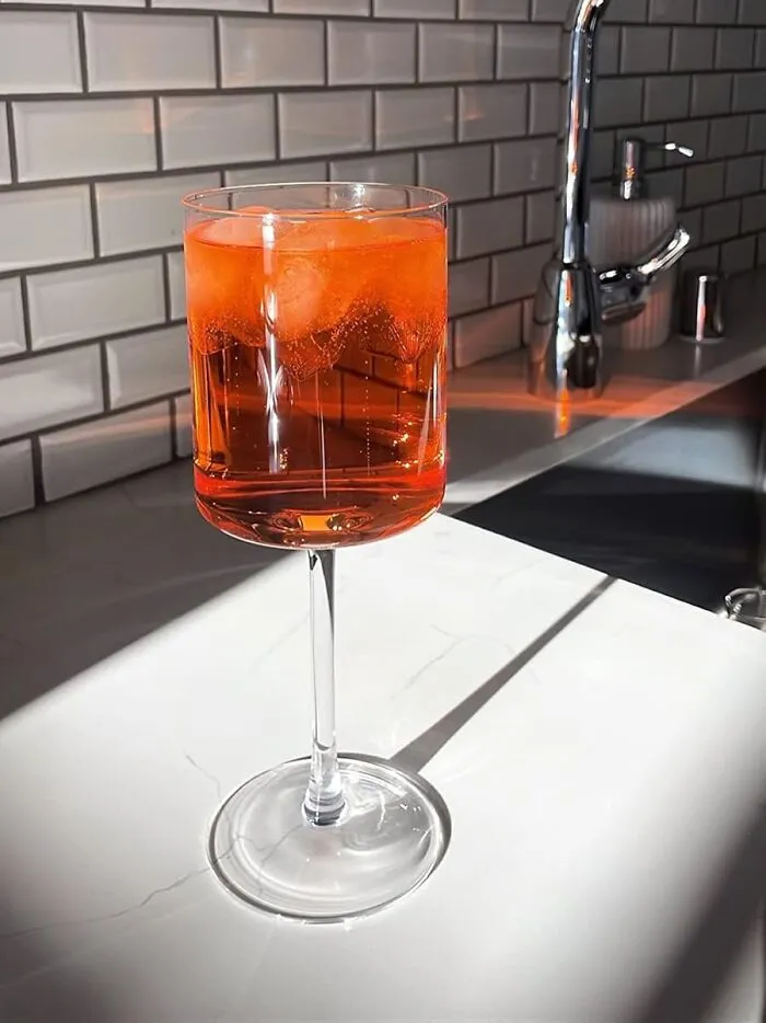 The Official Glassware Of A Host Who Is Both Incredibly Chic And A Little Bit Of A Rebel Is A Set Of <a Style="Display:inline;" Href="Https://Www.amazon.com/Wine-Glasses-Large-White-Glass/Dp/B0735gbjk2?ie=utf8&th=1&linkcode=ll1&tag=bptapir-20&linkid=b47148dcac8266bfd1698613c88aac92&language=en_us&ref_=as_li_ss_tl" Target="_blank">   <span Style="Font: Inherit; Color: #d74b1f;"> Square Wine Glasses </Span>