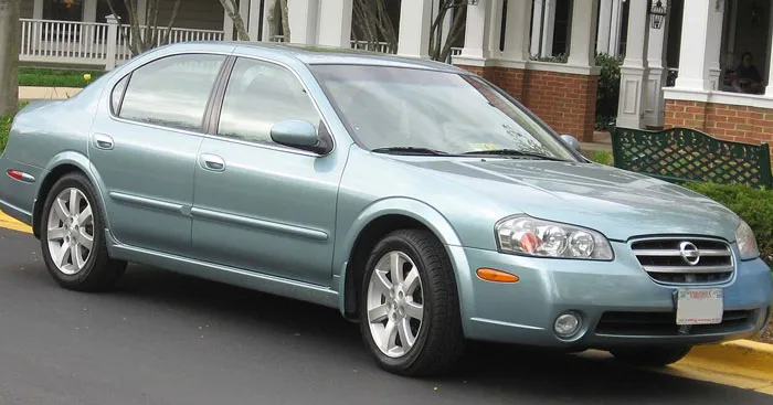 Light blue sedan parked on a street, representing frustration and stories about people who don’t deserve nice things.