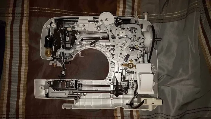 Inside view of a sewing machine showing detailed mechanical parts in interesting pictures of rarely seen insides