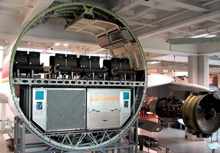 Cross-section view of an airplane interior and engine showing the insides of things we rarely see in detail.