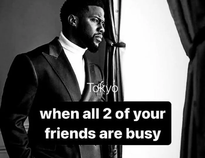 Man in suit looking out window with text about loneliness, a meme to help fight boredom and sadness.