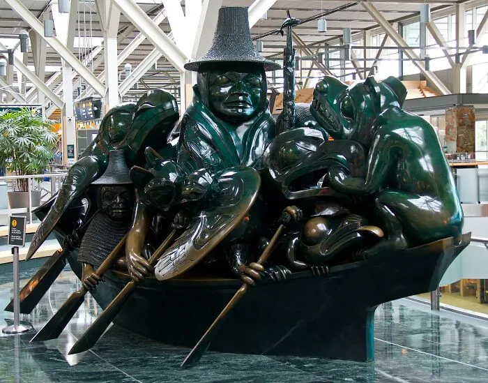 Intricate sculpture of figures and animals in a boat, showcasing spectacular sculptures that inspire global travel adventures.