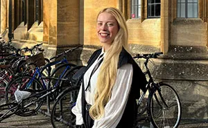 Woman Celebrating Her PhD Delivers Savage Response To Male Criticism, Internet Joins In