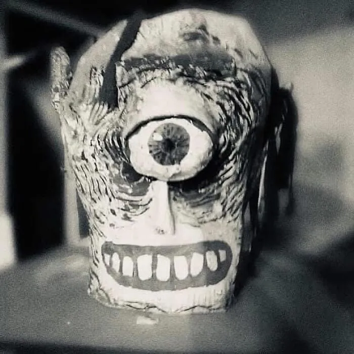 Ancient cyclops sculpture with carved details and weathered texture representing old objects from ancestors.
