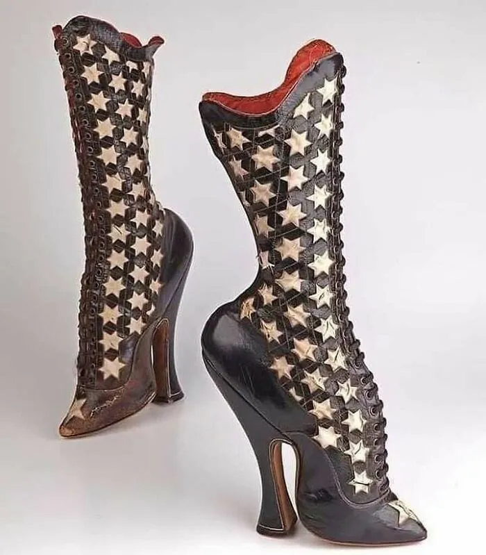 Very old high-heeled boots with star patterns, showcasing vintage craftsmanship and design from ancestors' era.