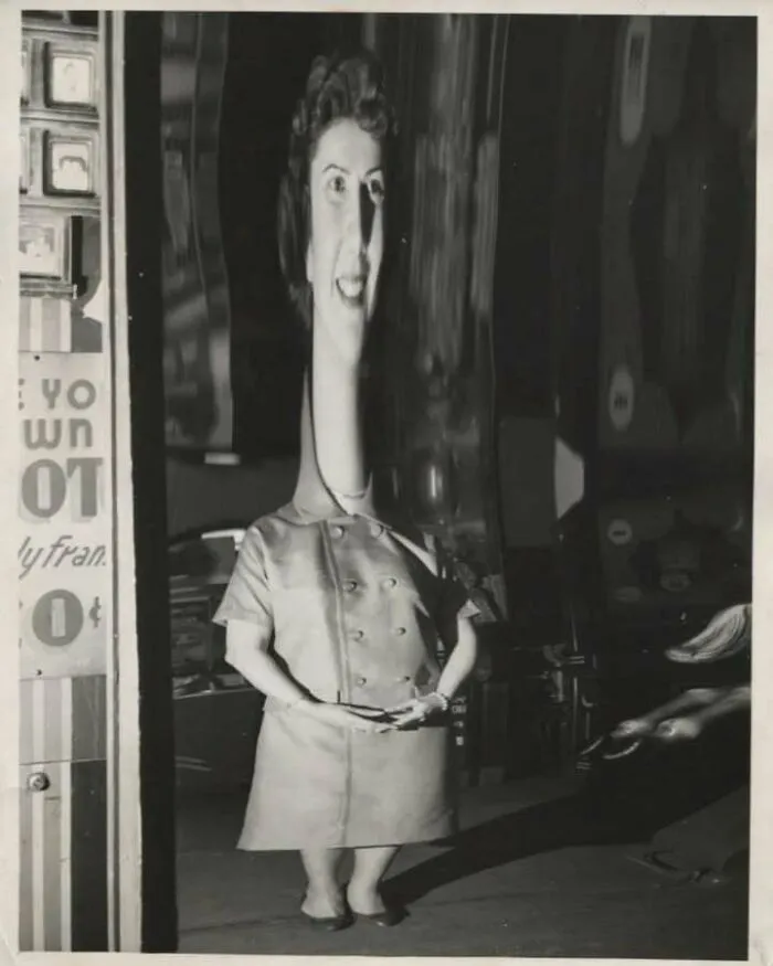 Distorted vintage black and white photo of a woman with enlarged head and shortened body showing old objects from ancestors.
