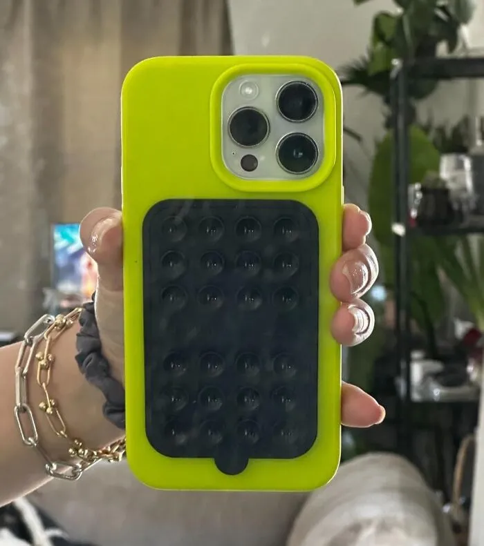 The <a Style="Display:inline;" Href="Https://Www.amazon.com/Octobuddy-Double-Sided-Detachable-Hands-Free-Compatible/Dp/B0cnn3h43t?ie=utf8&th=1&linkcode=ll1&tag=bpaxolotl-20&linkid=1bce472e2e6c40cf227fed57b2187737&language=en_us&ref_=as_li_ss_tl" Target="_blank"> <span Style="Font: Inherit; Color: #d74b1f;"> Octobuddy Silicone Double-Sided Suction Phone Case Mount </Span> Will Allow Them To Film Their Next Viral TikTok Dance Without Having To Precariously Balance Their Phone On A Pile Of Books
