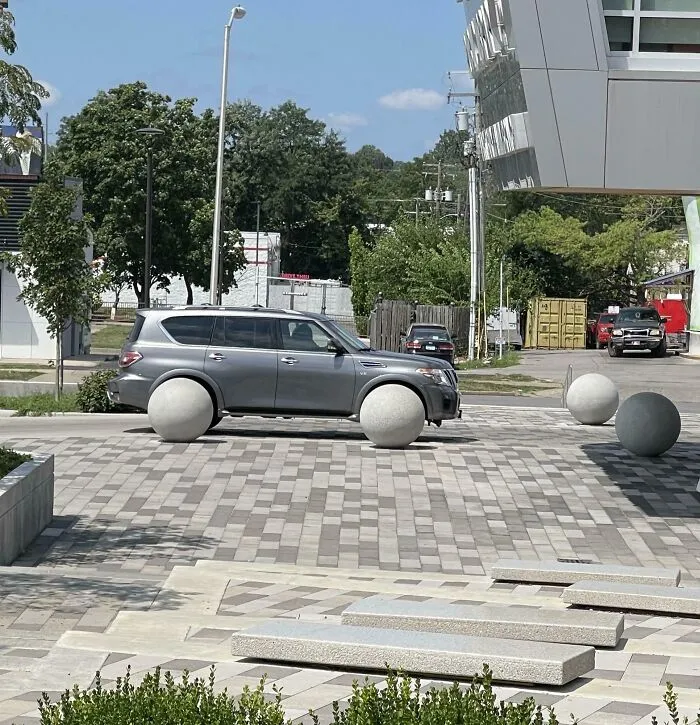The Way These Concrete Balls Lined Up To Look Like Wheels