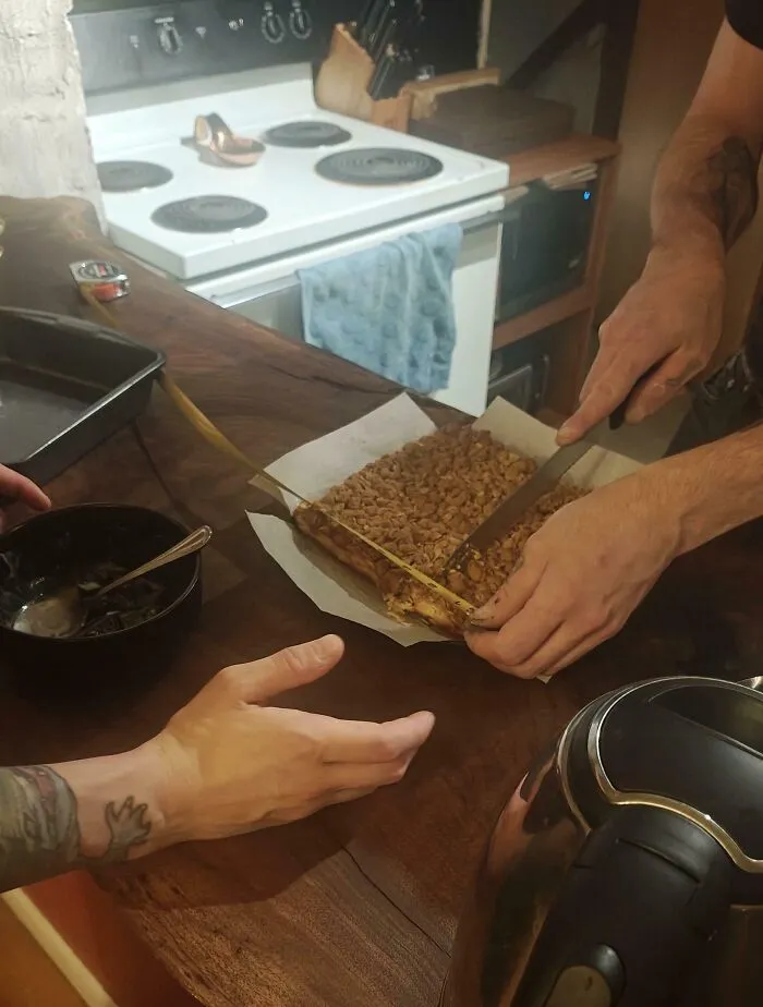 Two people in a rented kitchen cutting a homemade dessert, illustrating rental nightmares and landlord shortcuts exposed.