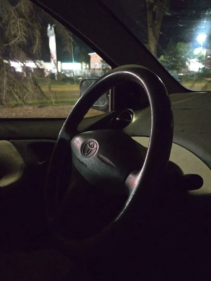 Steering wheel inside a dark car at night, symbolizing rental nightmares where landlords cut corners and got exposed.