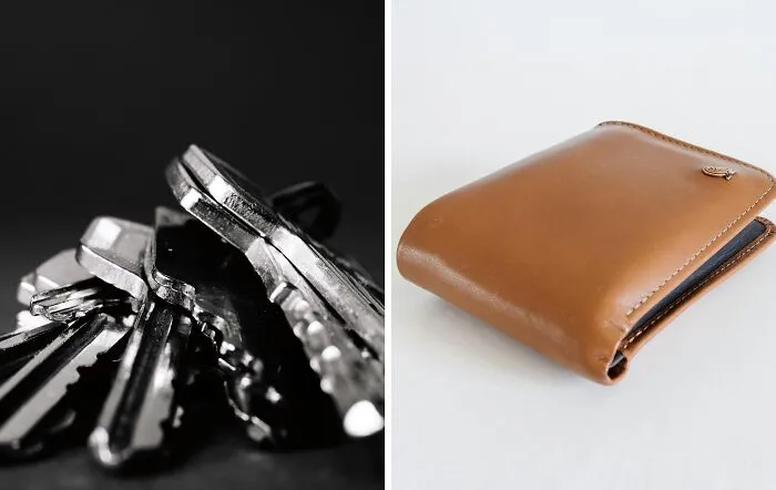 Close-up of metal keys on black surface beside a brown leather wallet on a white background, illustrating choice dilemmas.