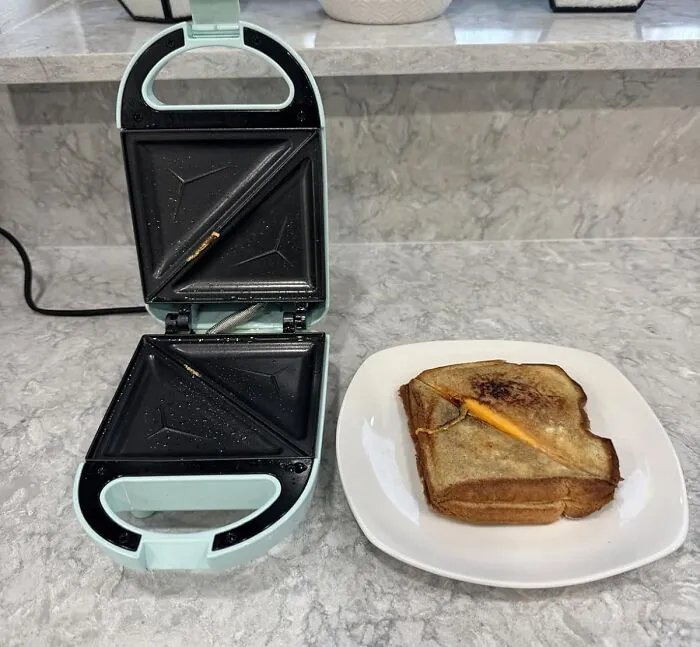 The Sad, Room-Temperature Sandwich You Packed For Lunch Can Now Be Transformed Into A Hot, Toasty, And Deeply Satisfying Pocket Of Melted Cheese And Happiness With A <a Style="Display:inline;" Href="Https://Www.amazon.com/Tasty-Mini-Sandwich-Maker-Aqua/Dp/B0cbd3z29f?ie=utf8&th=1&linkcode=ll1&tag=bpcrocodile-20&linkid=3c45f4695afa2cff45c8fa2d10cb339f&language=en_us&ref_=as_li_ss_tl" Target="_blank">   <span Style="Font: Inherit; Color: #d74b1f;"> Mini Sandwich Maker </Span>