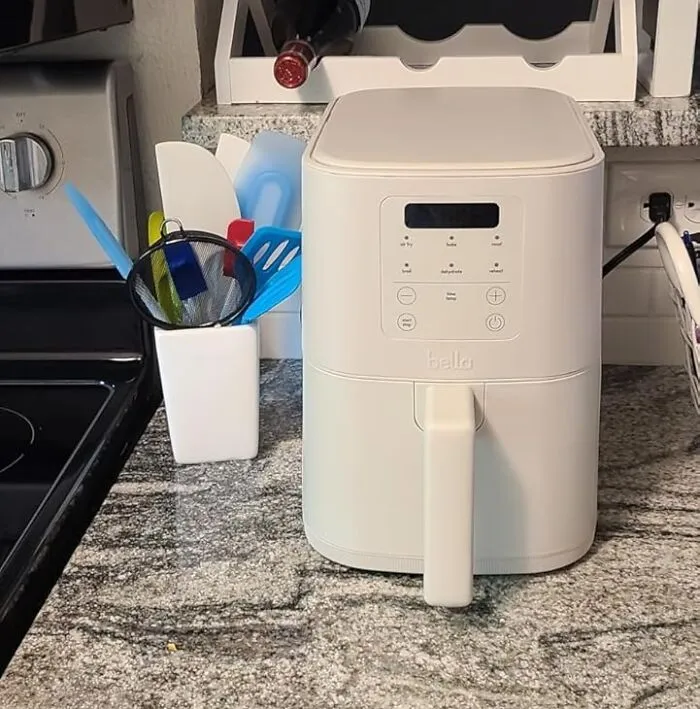 They Won't Have To Choose Between Owning A Toaster And Making Crispy Wings Once The <a Style="Display:inline;" Href="​​https://Www.amazon.com/Fits-Anywheretm-Kitchenware-Evergoodtm-Adjustable-Temperature/Dp/B0cyjdvt31?ie=utf8&th=1&linkcode=ll1&tag=bpraccoon-20&linkid=7a3d1aefc15a2fc88033aca21554514b&language=en_us&ref_=as_li_ss_tl" Target="_blank">   <span Style="Font: Inherit; Color: #d74b1f;"> Bella Slim Air-Fryer </Span> Squeezes Onto Their Crowded Countertop