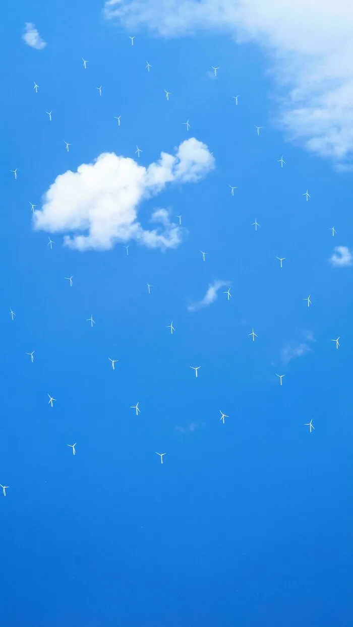 Windmills In The Ocean, As Seen From A Plane Window