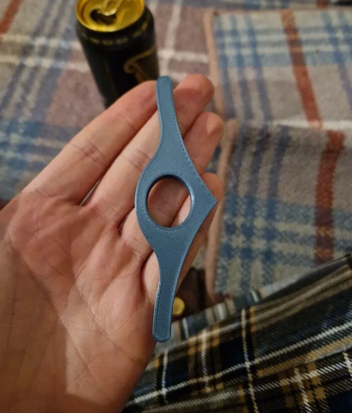 Hand holding a bizarre plastic object, one of the most bizarre things people received as Christmas gifts.