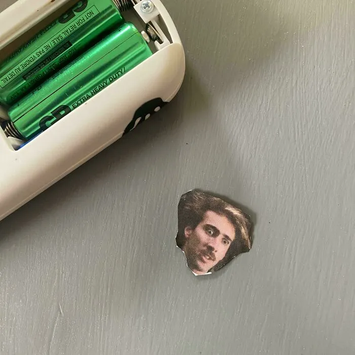 Eight-Years-Ago My Sister Housesat For Me And Hid Dozens Of Tiny Pictures Of Nicolas Cage All Over My Home, And Today, I Found This Guy In My Ceiling Fan Remote