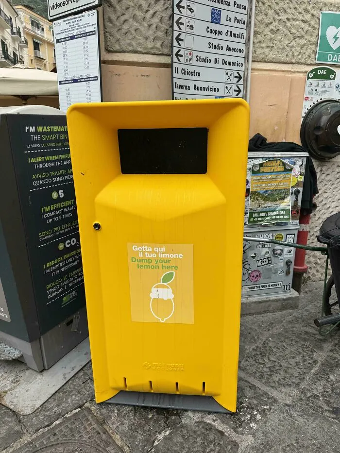 Yellow bin labeled for lemon disposal in a public area, showcasing an impressive country implementation that left people in awe.